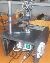 Sewing machine servo motor varies distributor rotational speed