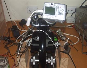 Camera on early Zeiss microscope required making special adapters. Camera on early Zeiss microscope required making special adapters.