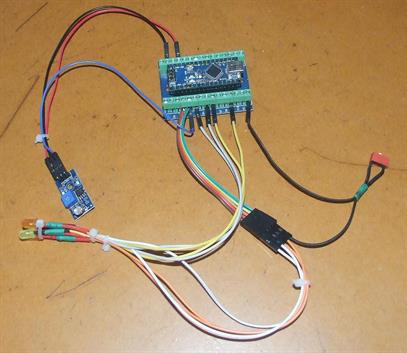 Flickering flame ESP32 sits in a metal can underneath LED bundle